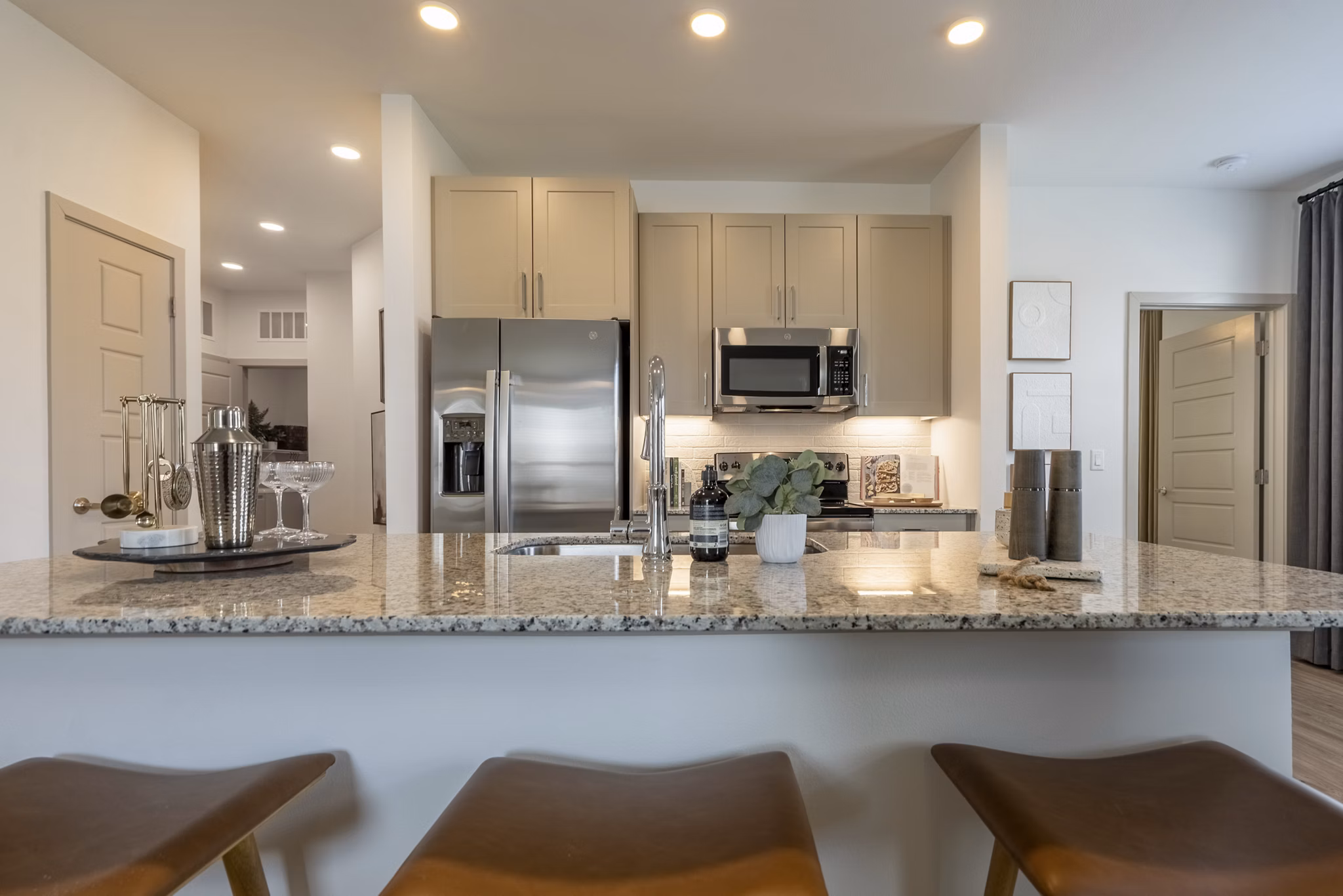 Modern kitchen with stainless steel appliances at Alta Berry Creek Apartments