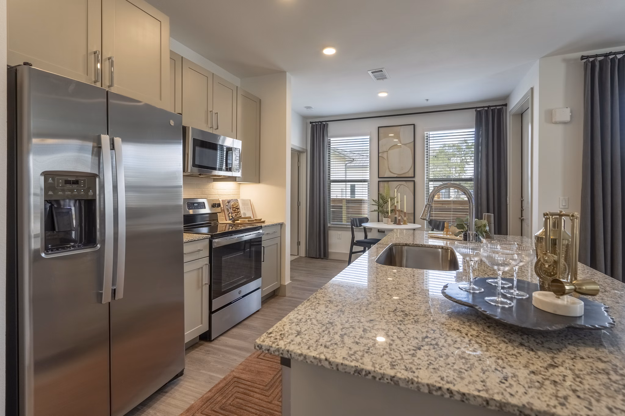 Modern kitchen with stainless steel appliances at Alta Berry Creek Apartments