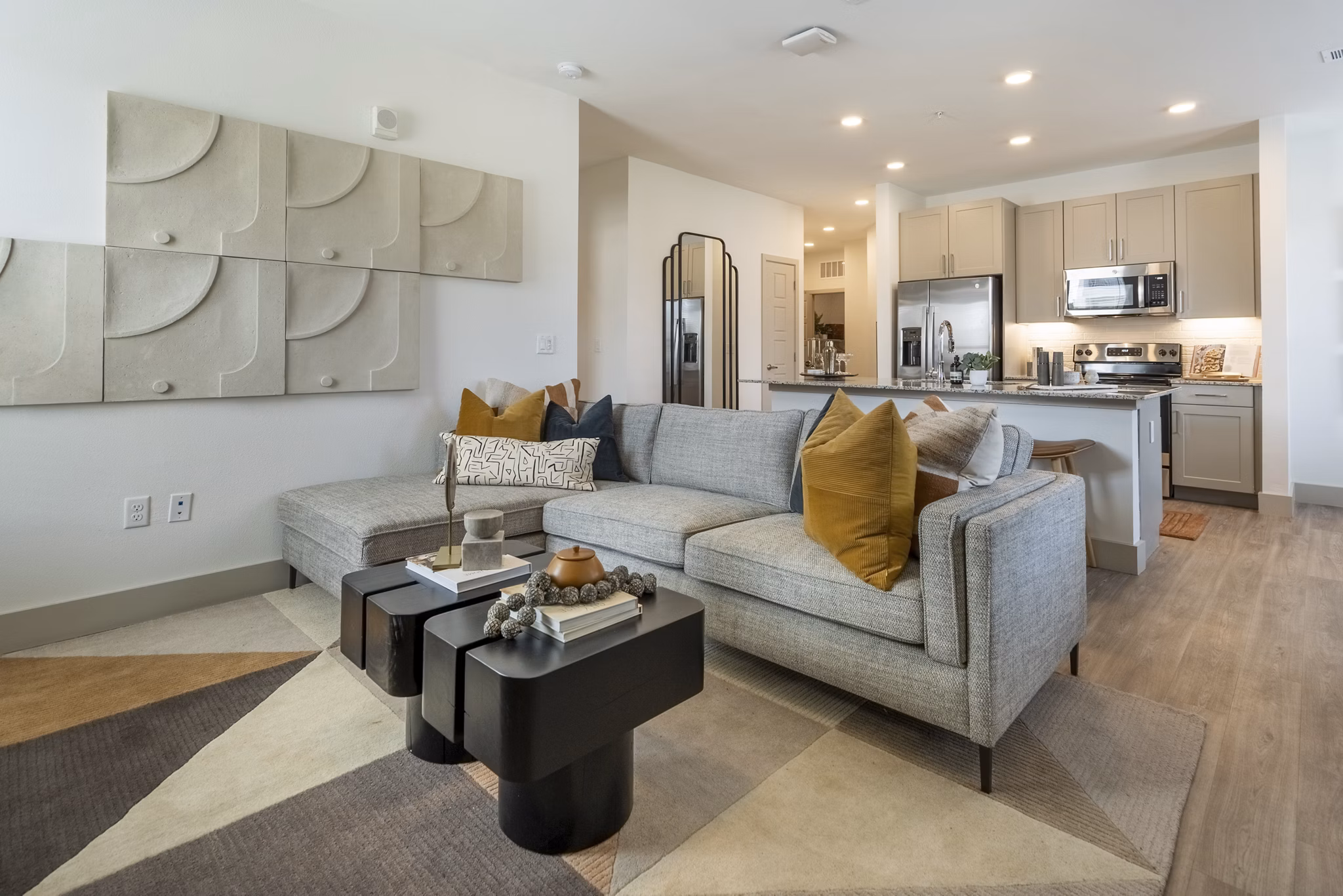 Spacious living room with modern decor and natural lighting in Alta Berry Creek Apartments