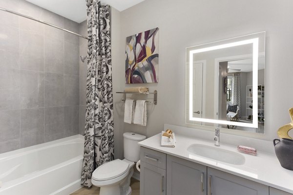 Alta Biltmore: Modern bathroom with sleek fixtures and ample storage space at luxury apartments in Phoenix