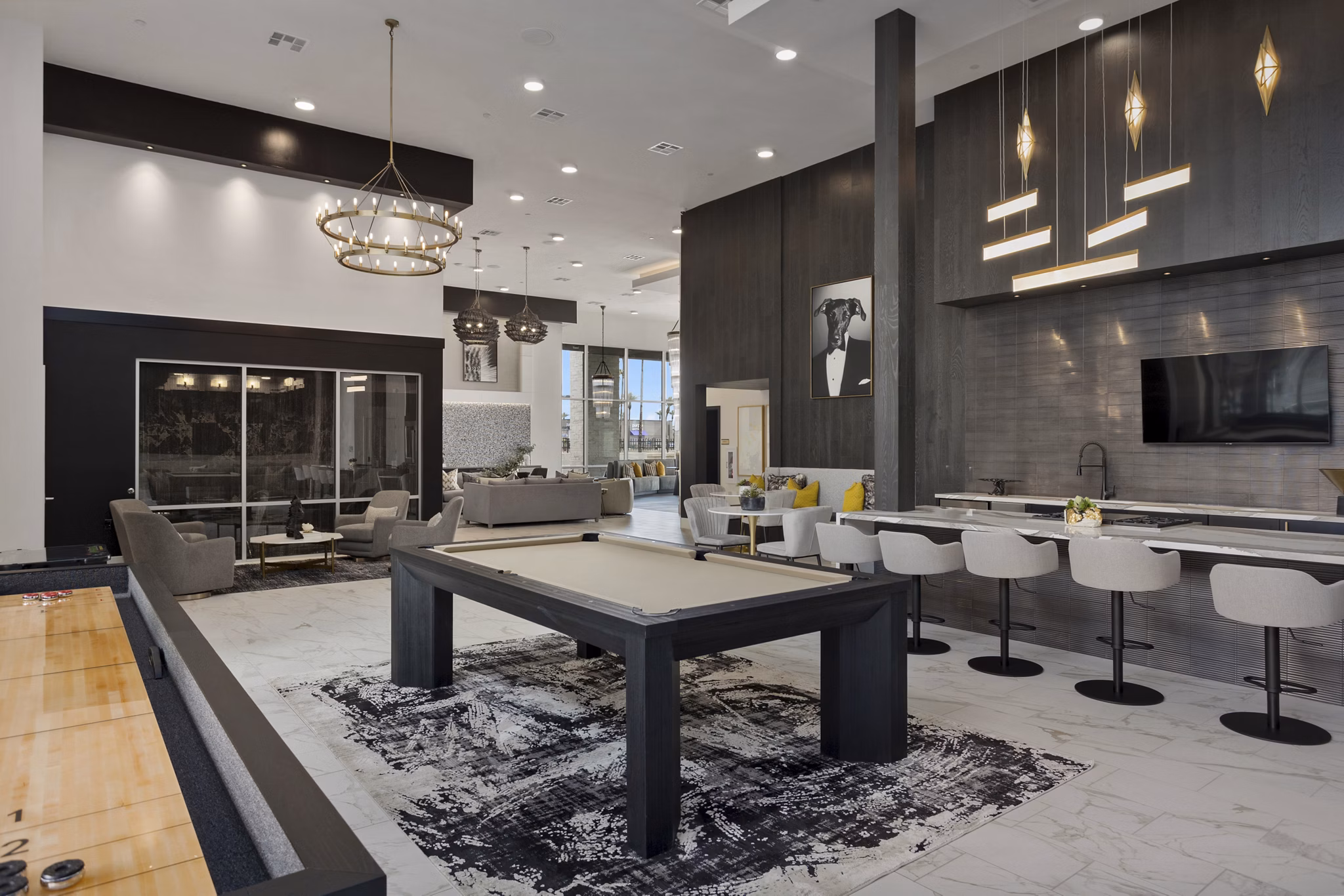 Clubhouse with stylish seating and large windows at Alta Biltmore Apartments in Phoenix