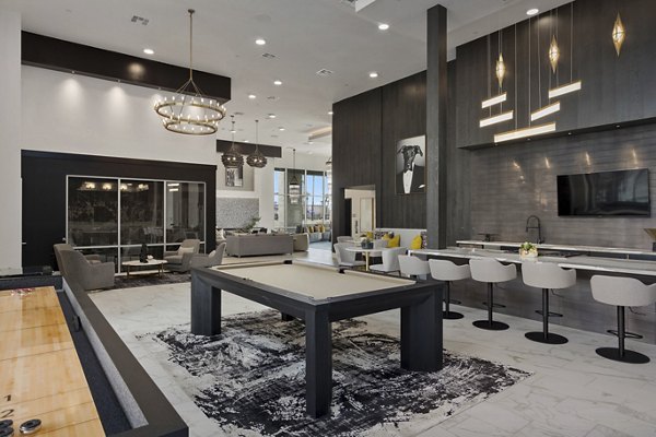 Clubhouse with stylish seating and large windows at Alta Biltmore Apartments in Phoenix