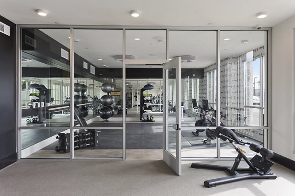Modern fitness center with state-of-the-art equipment at Alta Biltmore Apartments, offering luxury amenities for active lifestyles