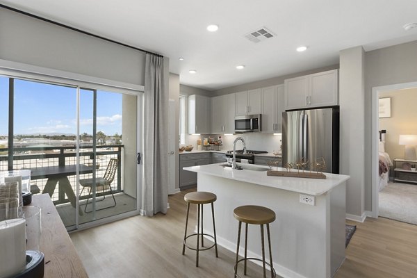 Modern kitchen with stainless steel appliances in Alta Biltmore Apartments