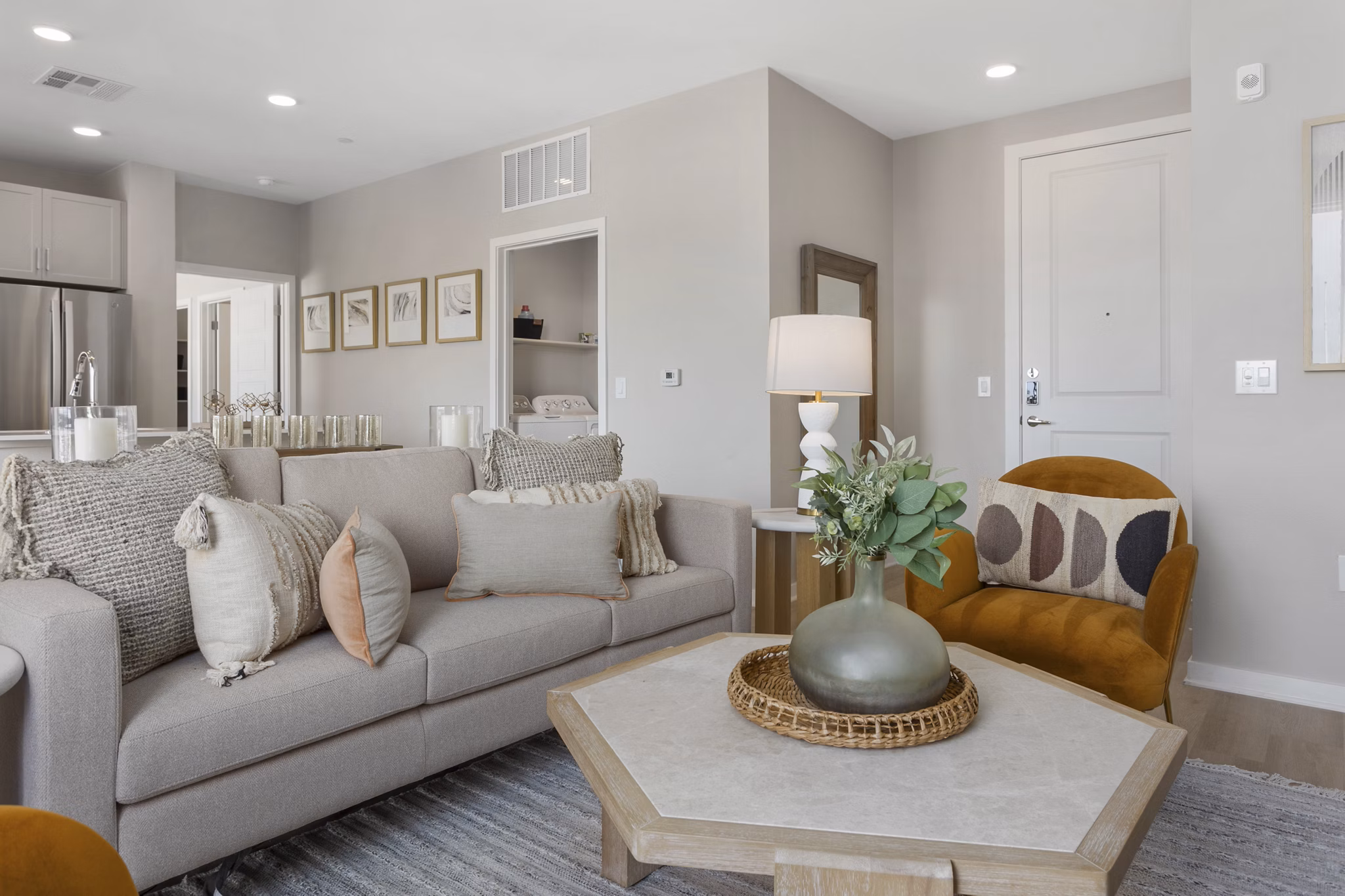 Living room with modern furnishings and large windows at Alta Biltmore luxury apartments