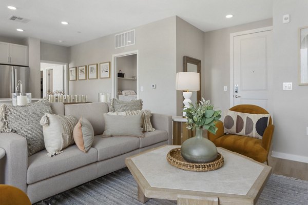 Living room with modern furnishings and large windows at Alta Biltmore luxury apartments