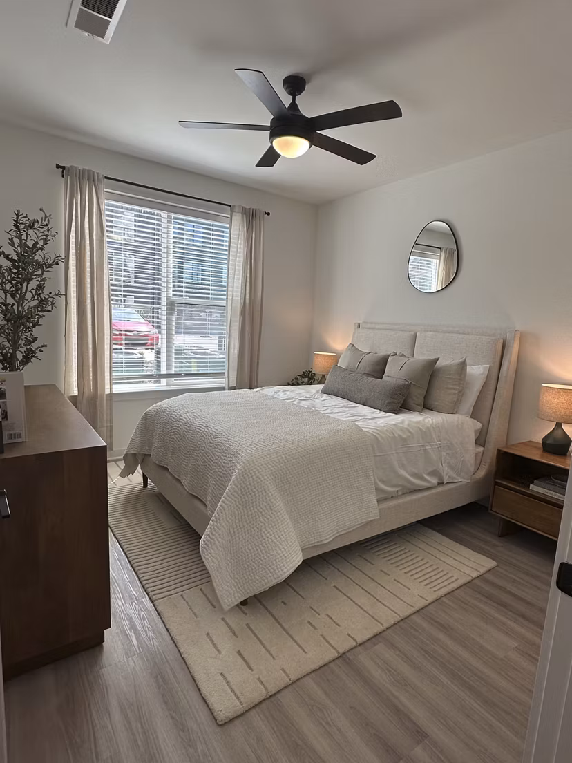 Alta City Side Apartments: Modern bedroom with elegant furnishings and large windows in Greystar luxury apartments