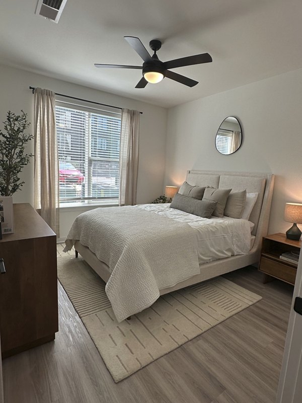 Alta City Side Apartments: Modern bedroom with elegant furnishings and large windows in Greystar luxury apartments