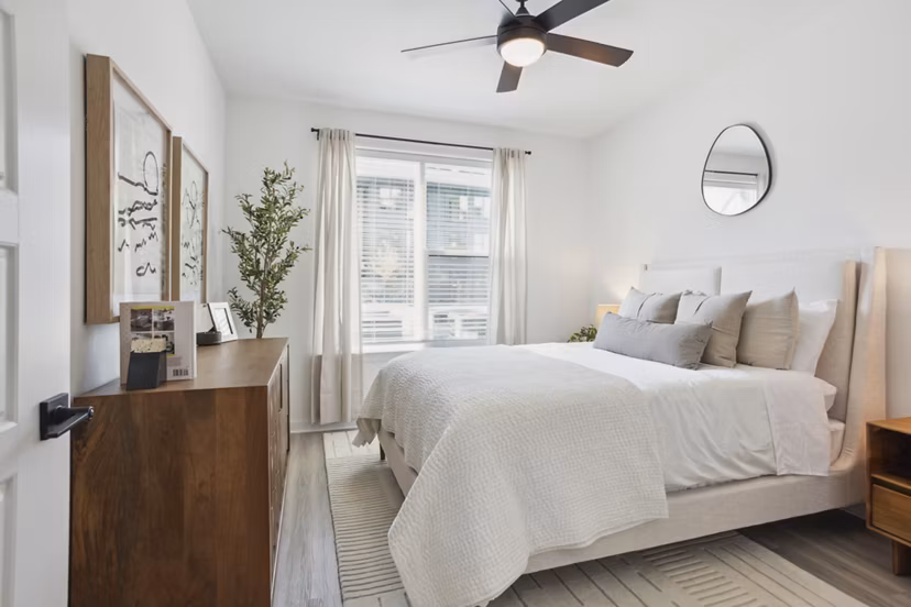 Spacious bedroom with modern decor at Alta City Side Apartments