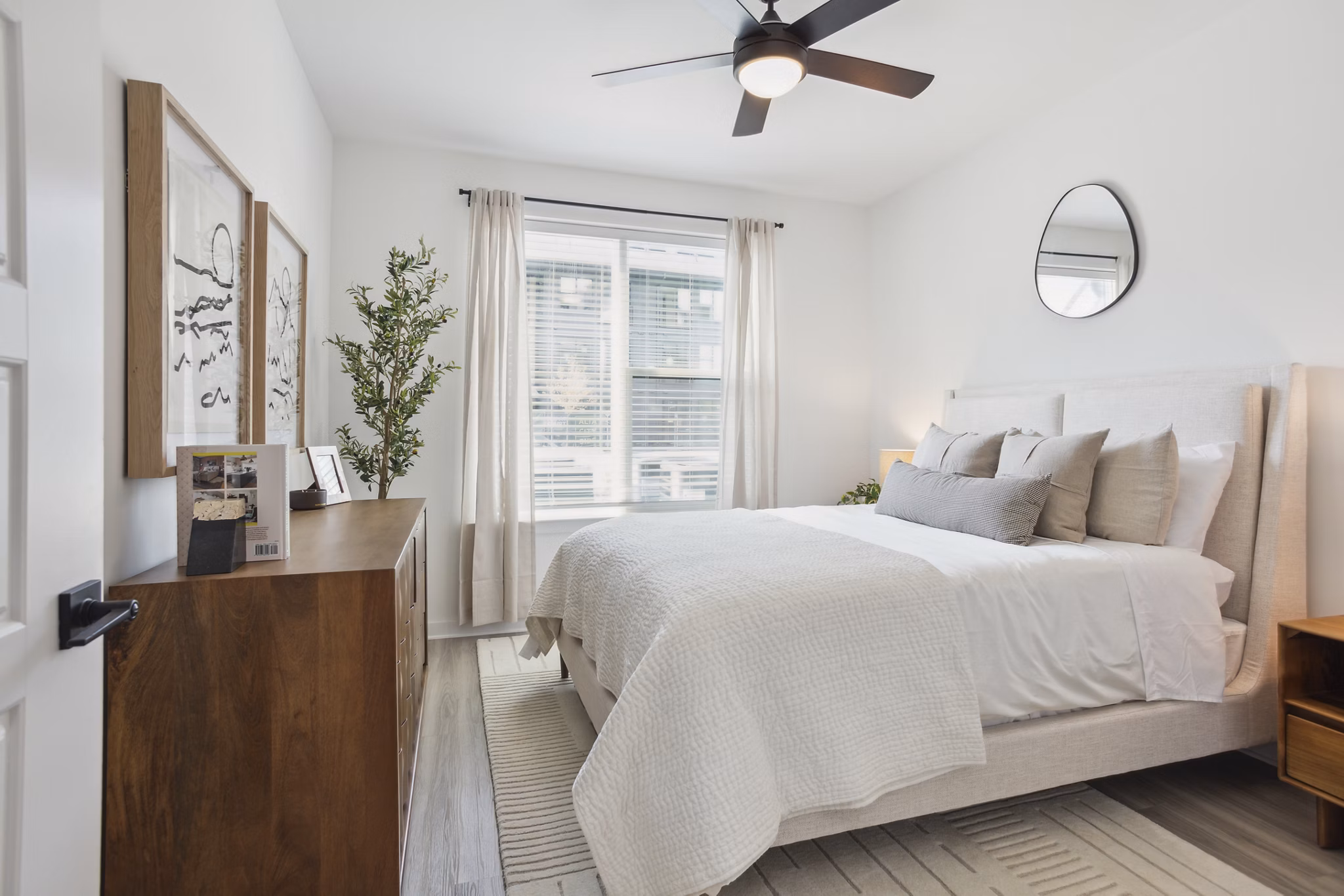 Spacious bedroom with modern decor at Alta City Side Apartments