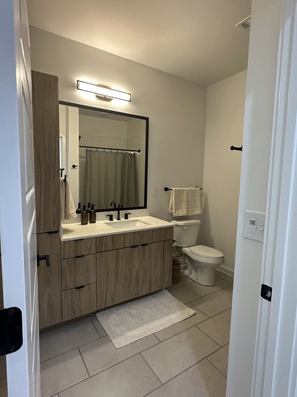 Bathroom featuring modern fixtures at Alta City Side Apartments