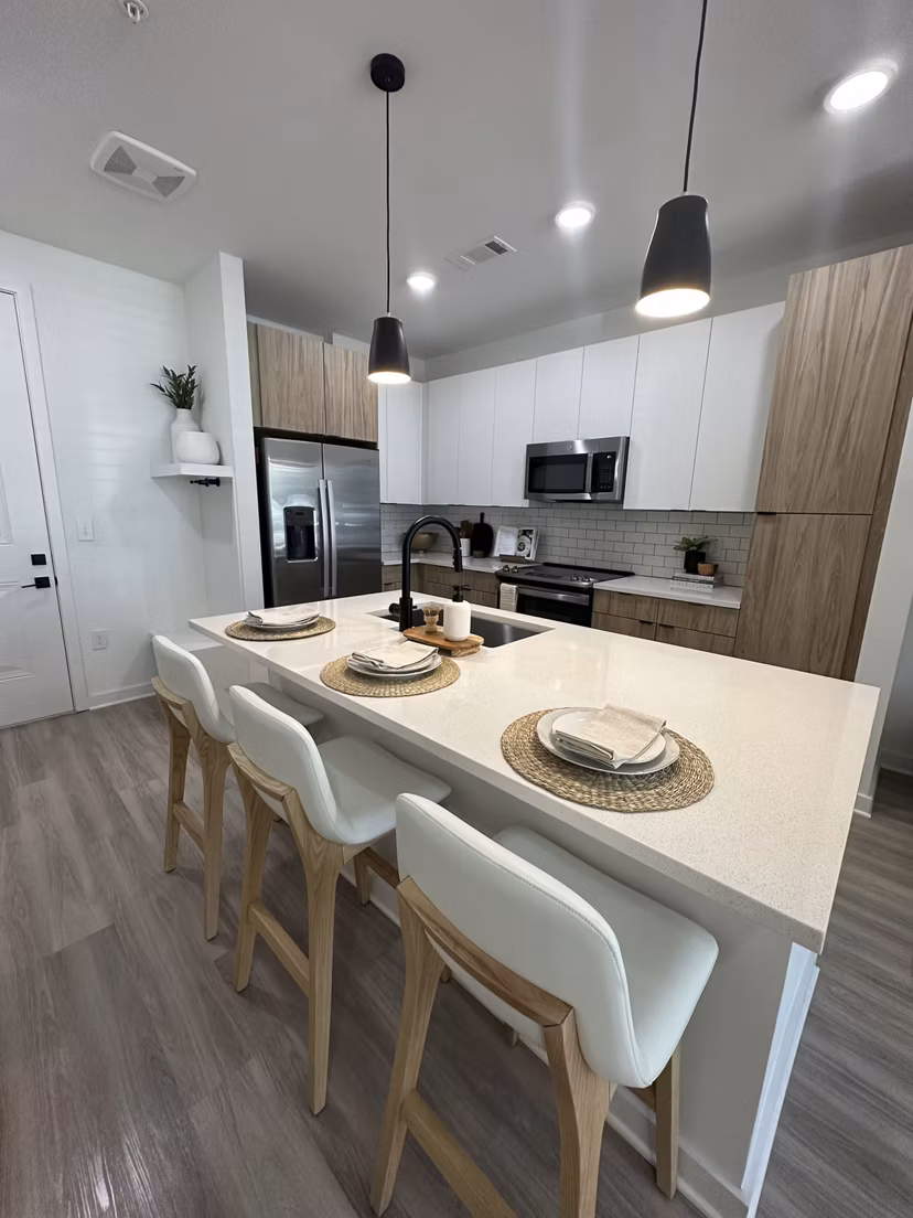 Modern kitchen with stainless steel appliances at Alta City Side Apartments