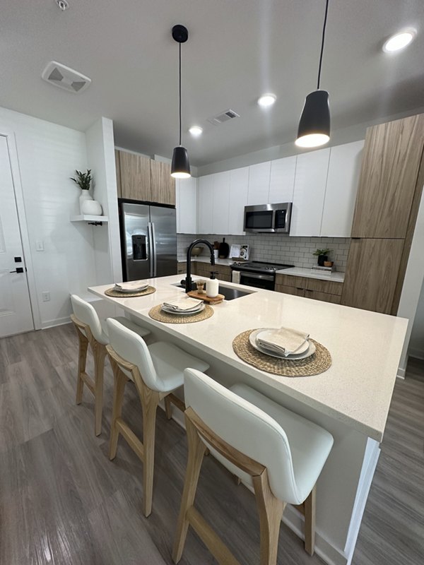 Modern kitchen with stainless steel appliances at Alta City Side Apartments