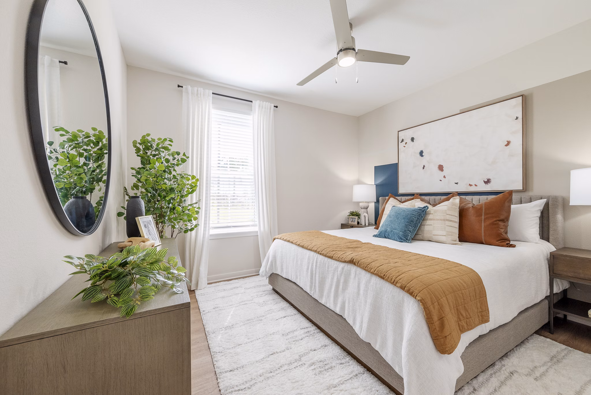 Comfortable bedroom with elegant decor at Alta Citron Apartments, a Greystar luxury property