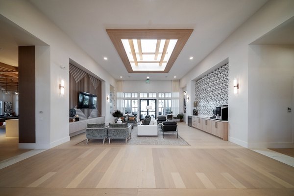 Clubroom featuring modern decor and seating options at Alta Citron Apartments