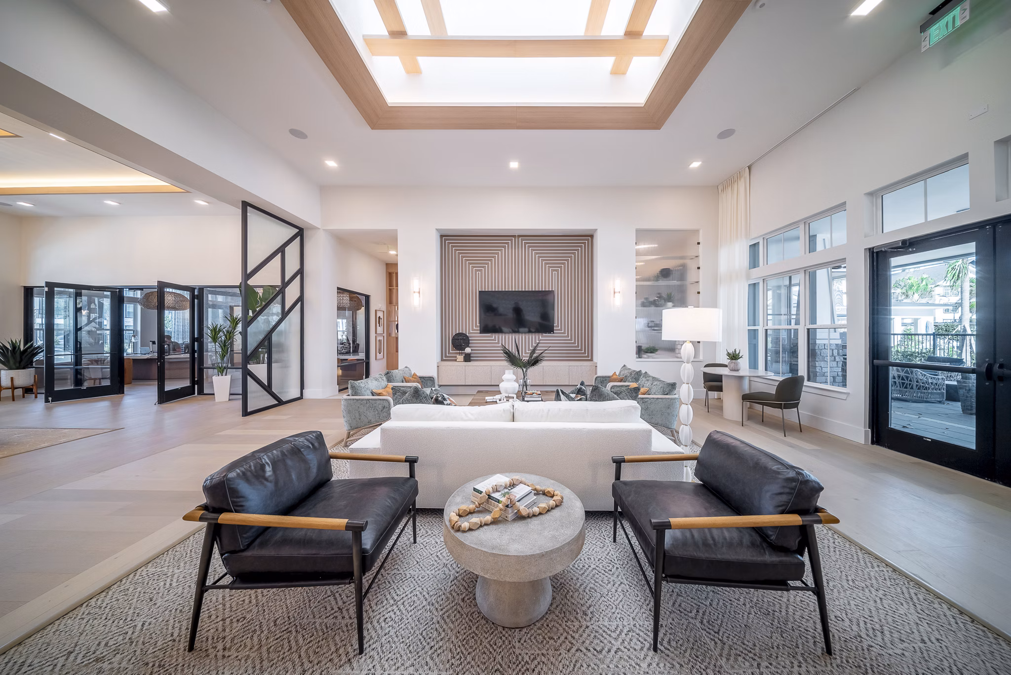 Modern clubroom with cozy seating and vibrant decor at Alta Citron Apartments, ideal for hosting gatherings and community events