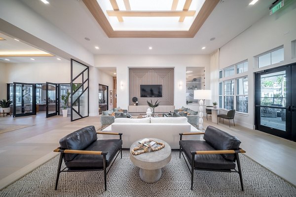 Modern clubroom with cozy seating and vibrant decor at Alta Citron Apartments, ideal for hosting gatherings and community events
