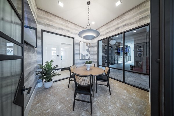 Clubroom with modern furnishings and entertainment features at Alta Citron luxury apartments