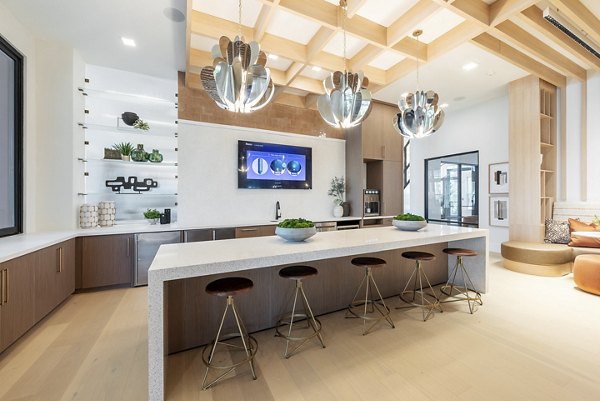 Clubroom featuring modern seating and entertainment options at Alta Citron Apartments