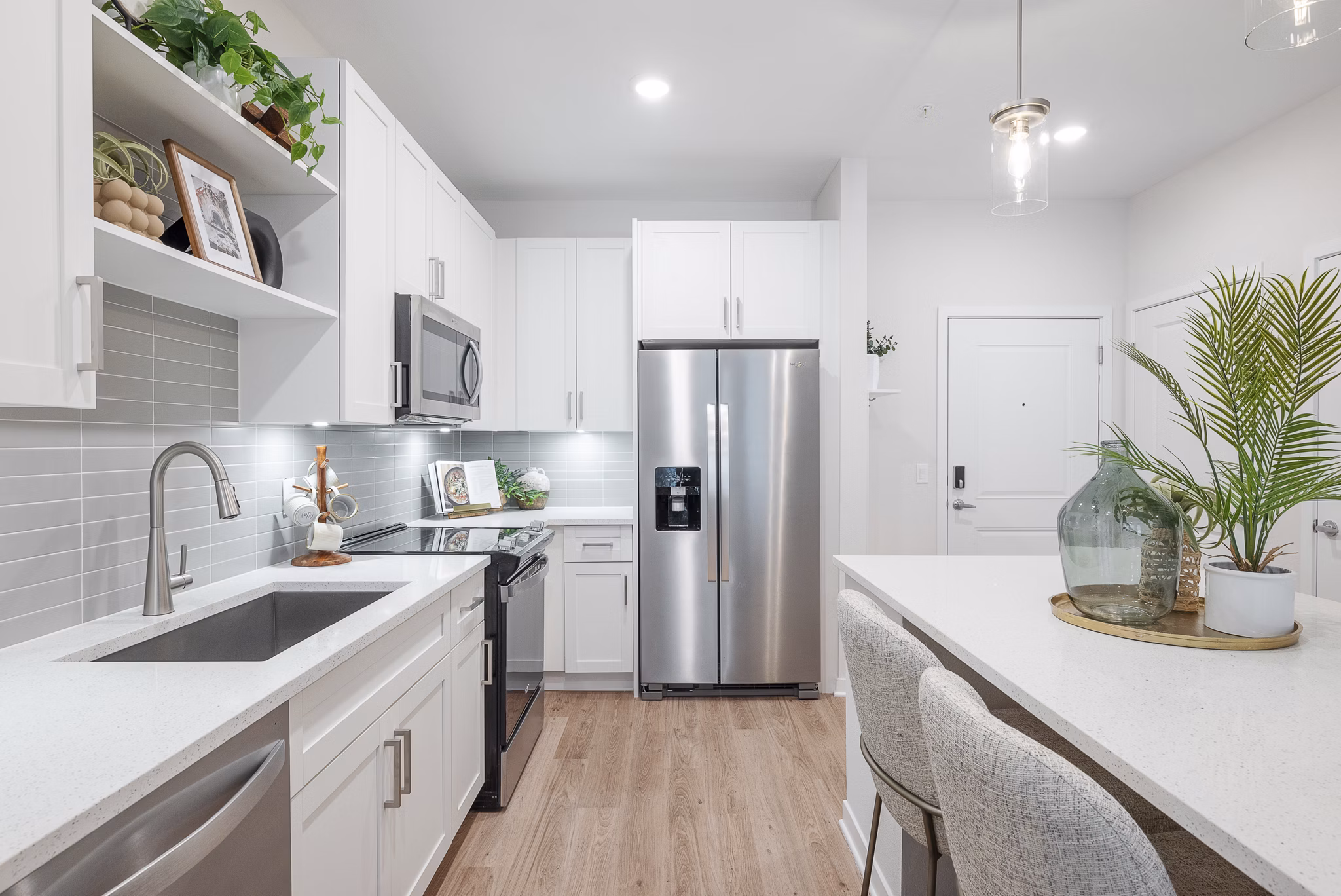 Modern kitchen with stainless steel appliances at Alta Citron Apartments, Greystar luxury living