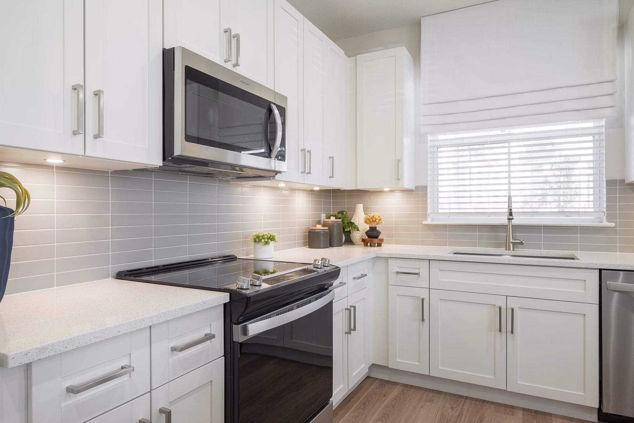 Sleek kitchen with stainless steel appliances at Alta Citron Apartments