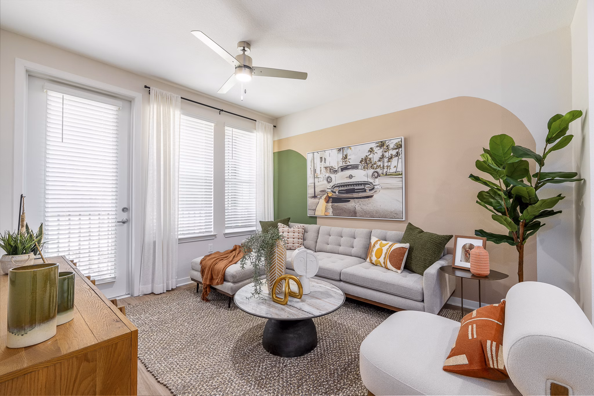 Spacious living room with modern decor and natural light at Alta Citron Apartments