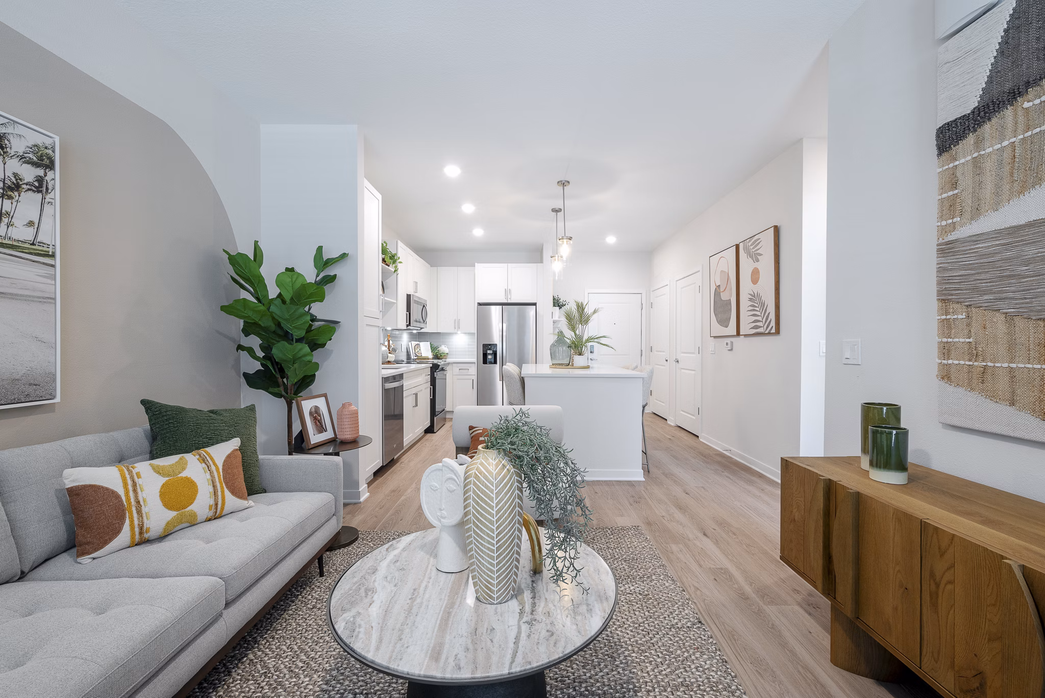 Spacious living room with modern decor and large windows at Alta Citron Apartments, luxury living with Greystar's exceptional design