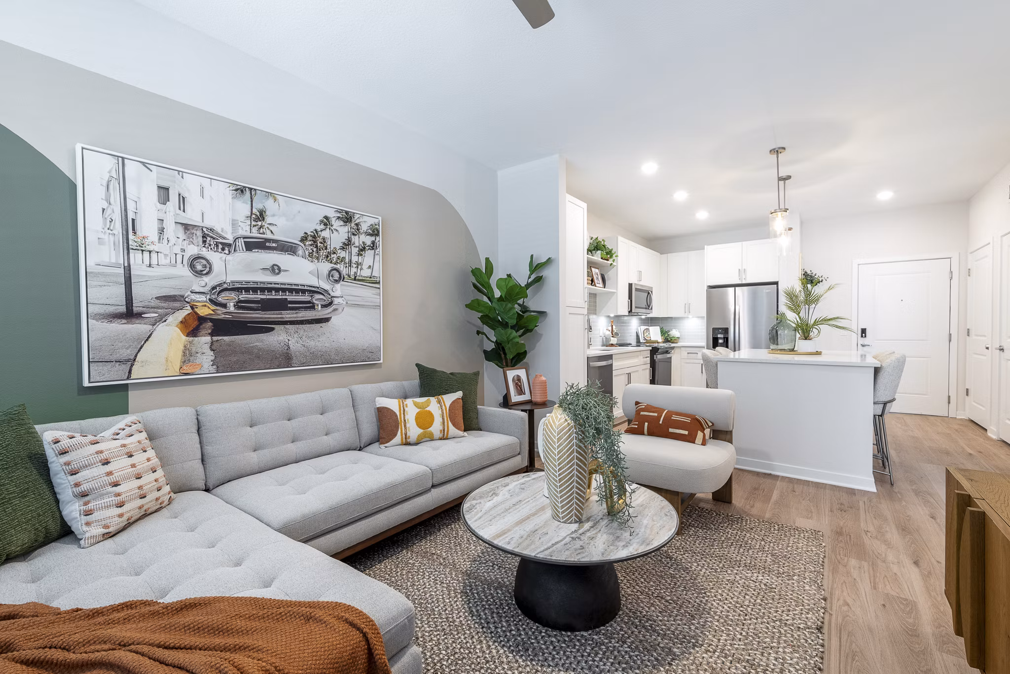 Spacious living room with modern decor and ample natural light in Alta Citron Apartments, luxury living at its best