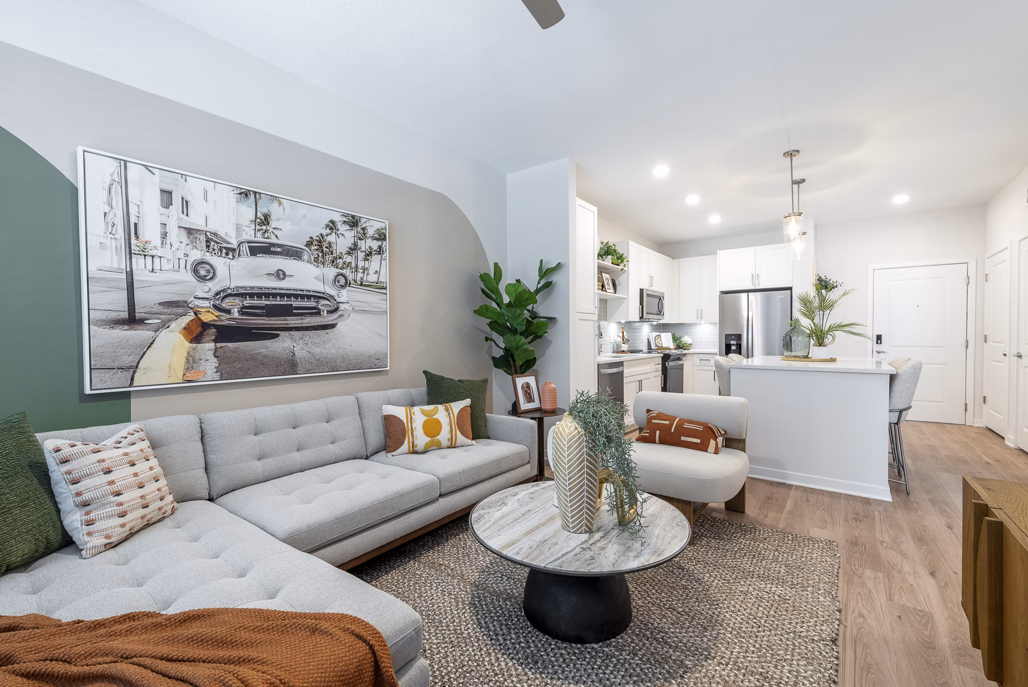 Spacious living room with modern decor and ample natural light in Alta Citron Apartments, luxury living at its best
