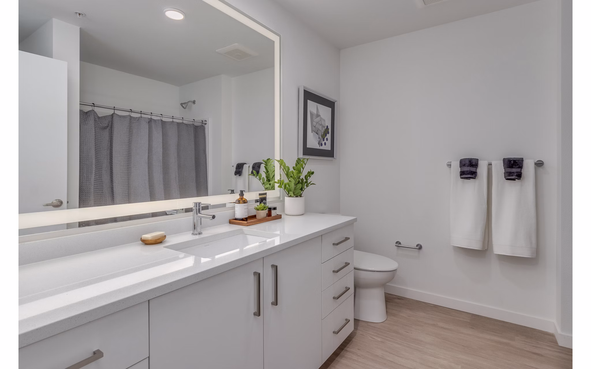 Alta Civic Station Apartments: Modern bathroom with sleek fixtures and ample counter space