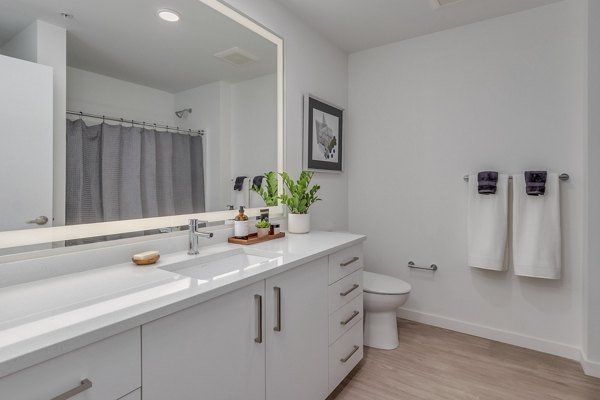 Alta Civic Station Apartments: Modern bathroom with sleek fixtures and ample counter space