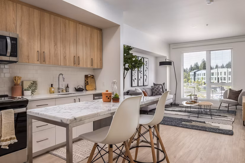 Kitchen with sleek countertops and modern appliances at Alta Civic Station luxury apartments