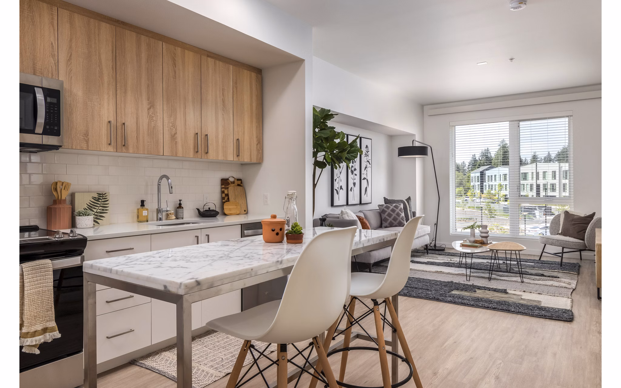Kitchen with sleek countertops and modern appliances at Alta Civic Station luxury apartments