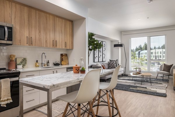 Kitchen with sleek countertops and modern appliances at Alta Civic Station luxury apartments