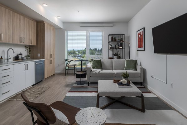 Contemporary living room featuring sleek furniture and large windows at Alta Civic Station luxury apartments