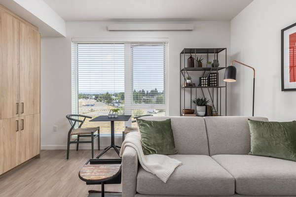 Spacious living room with modern furnishings at Alta Civic Station luxury apartments