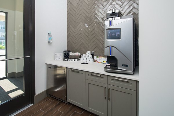 Clubhouse featuring modern furnishings and open design at Alta Clara at the Fells Apartments