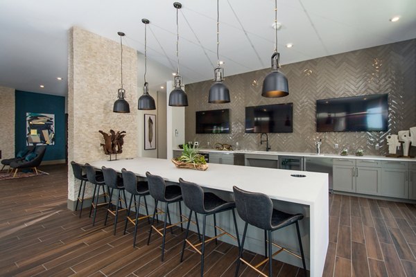 Clubhouse featuring modern design and comfortable seating at Alta Clara at the Fells Apartments