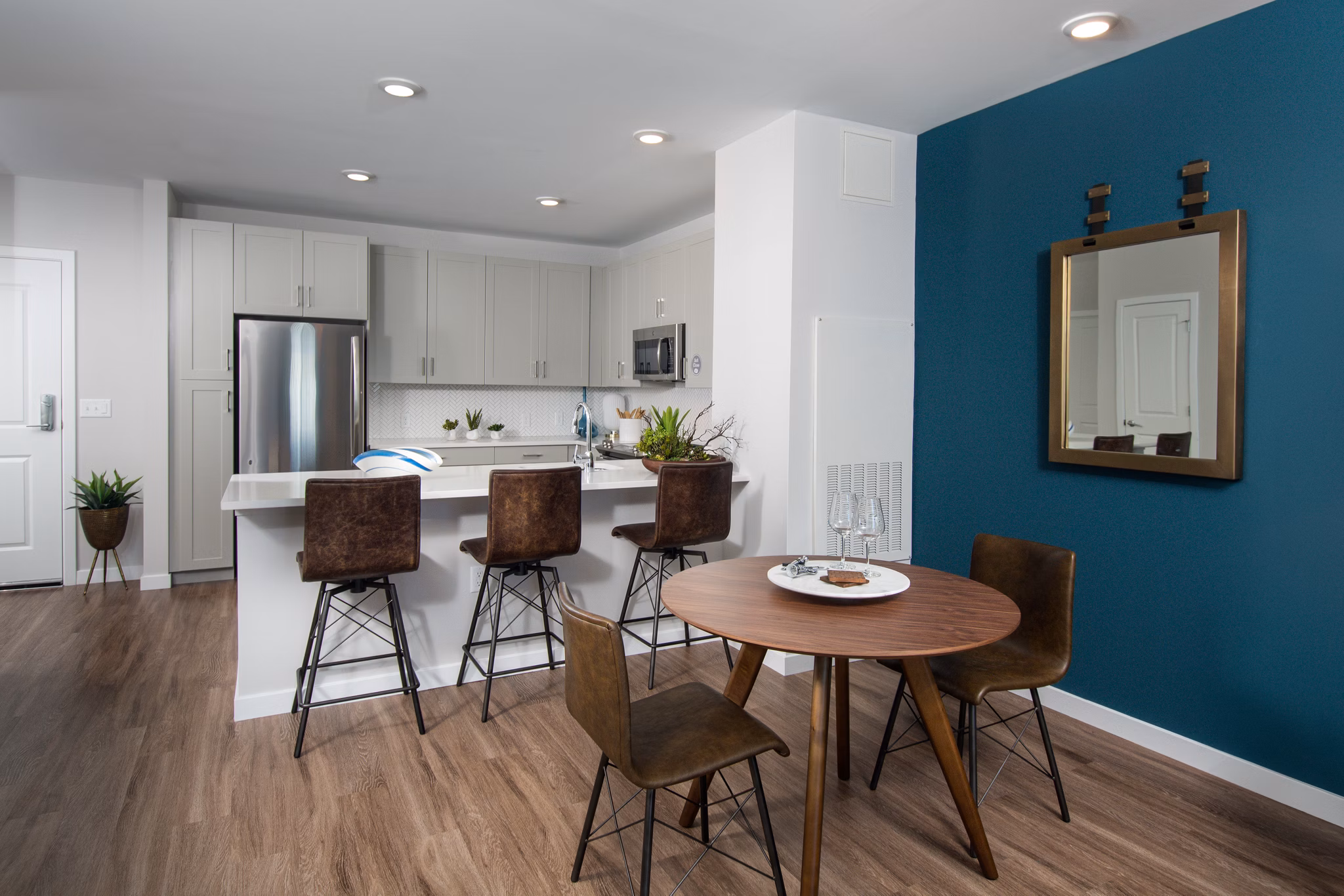 Elegant dining area with modern furnishings at Alta Clara at the Fells Apartments