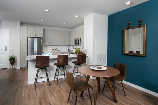 Elegant dining area with modern furnishings at Alta Clara at the Fells Apartments