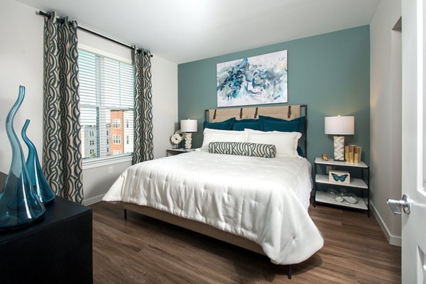 Modern bedroom with natural lighting and stylish decor in Alta Clara at the Fells Apartments