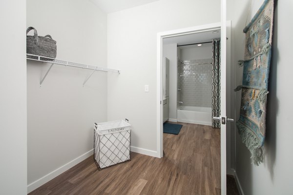 Walk-in closet with ample storage space in Alta Clara at the Fells Apartments