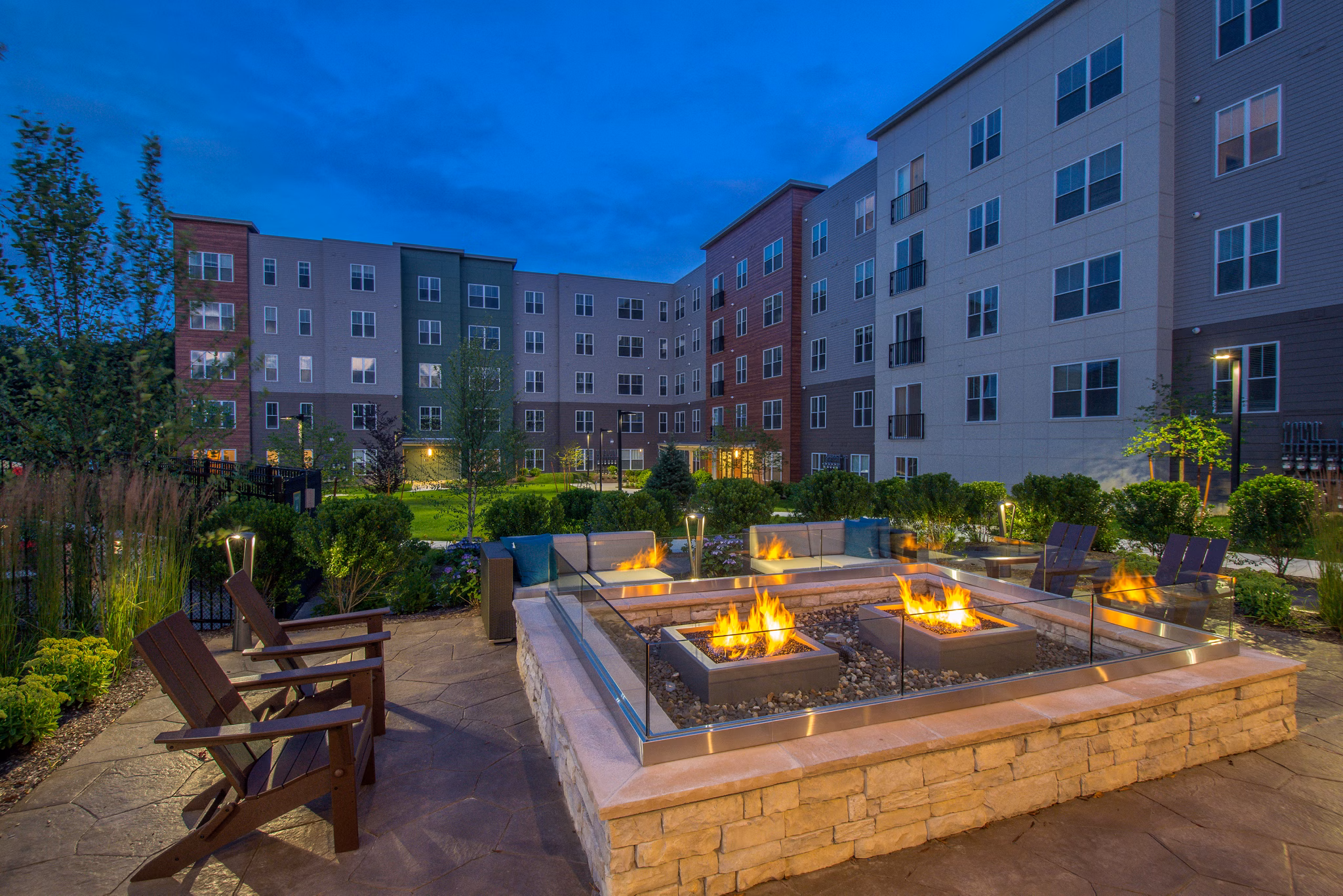 Cozy fire pit area at Alta Clara at the Fells Apartments, ideal for relaxing evenings outdoors