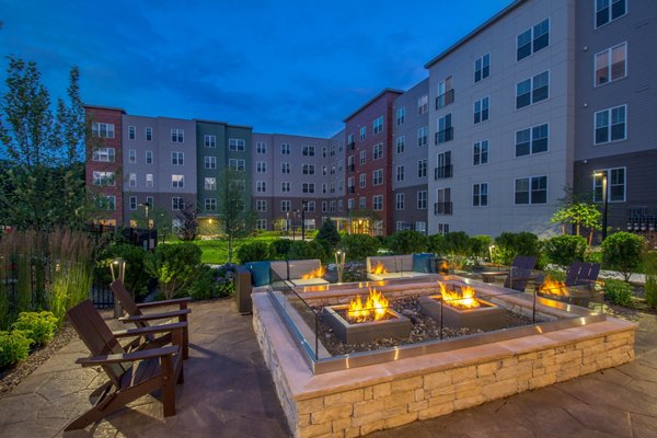 Cozy fire pit area at Alta Clara at the Fells Apartments, ideal for relaxing evenings outdoors
