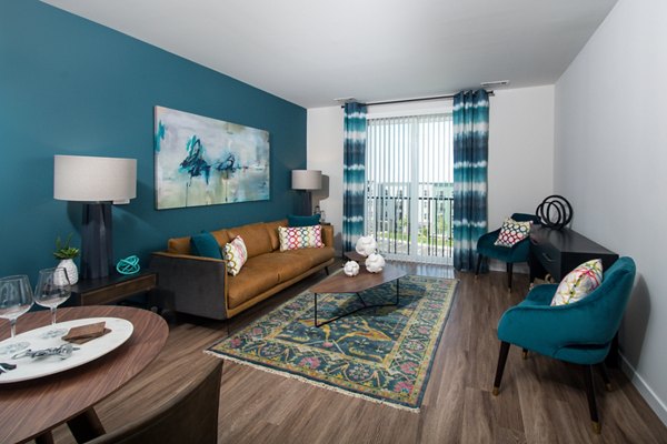 Alta Clara at the Fells: Scenic view of luxury apartments with lush greenery