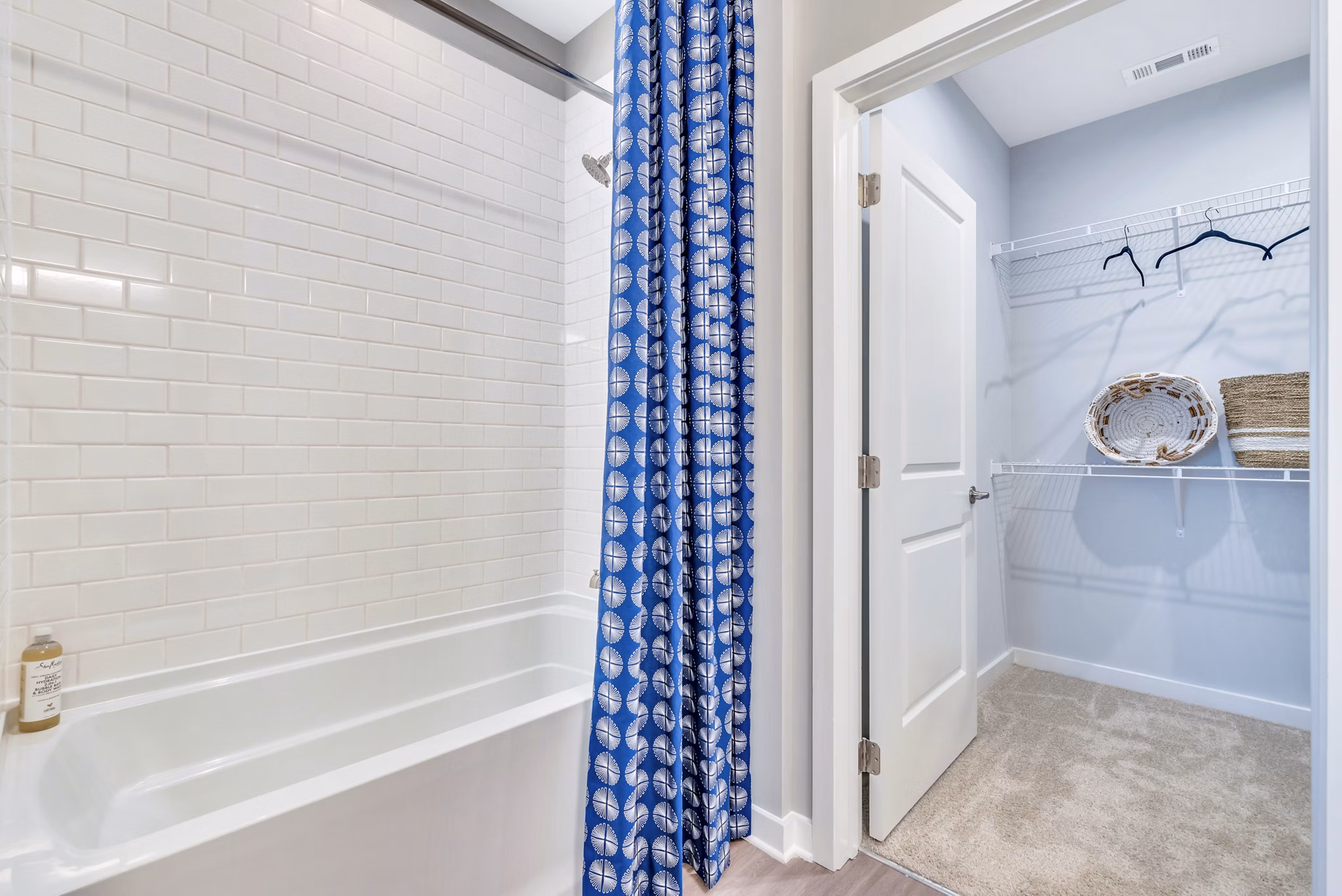Modern bathroom closet with ample shelving at Alta Croft Apartments, a luxury community