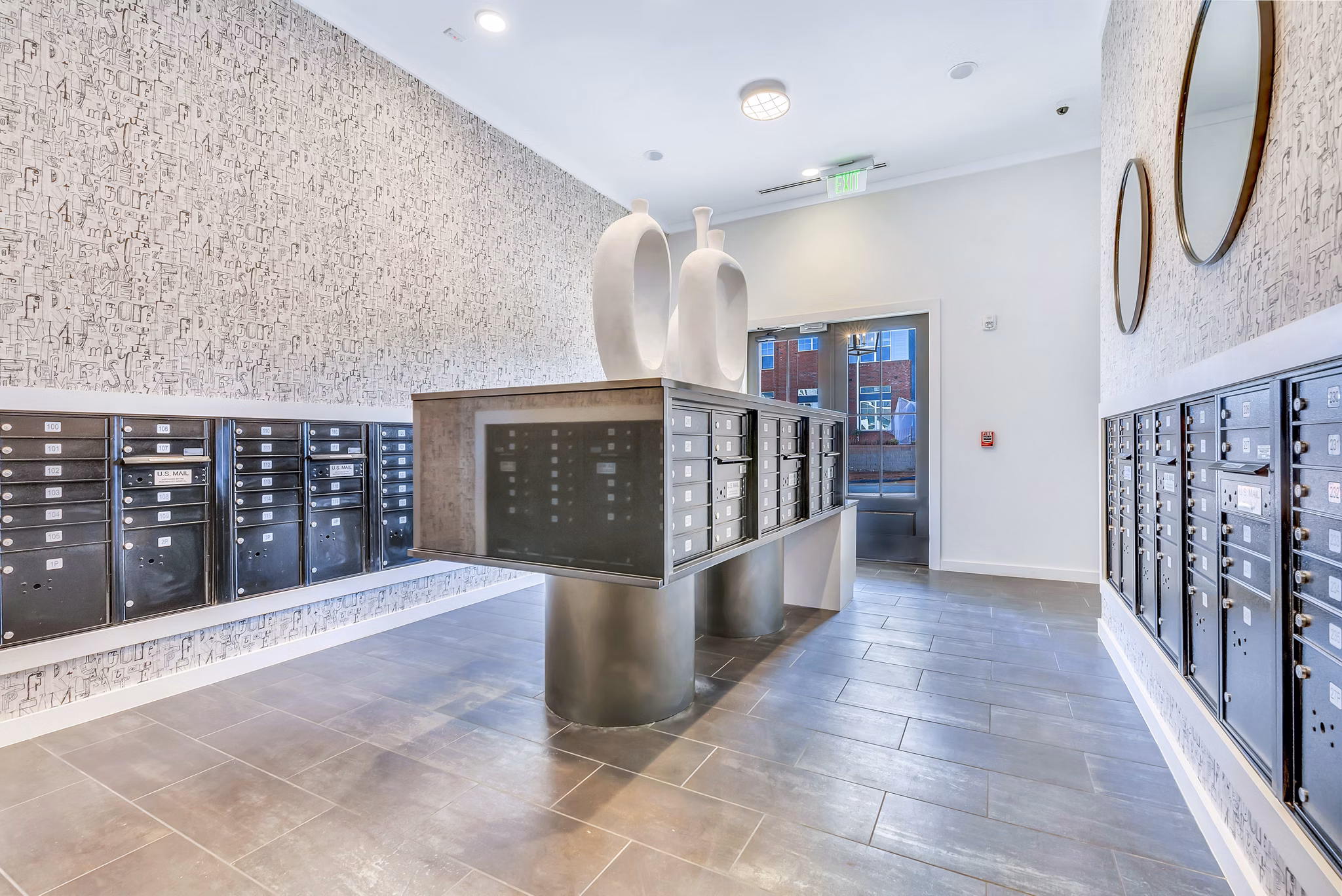 Modern mail room with secure parcel lockers at Alta Croft Apartments, luxury community offering premium services