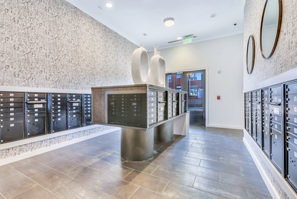 Modern mail room with secure parcel lockers at Alta Croft Apartments, luxury community offering premium services