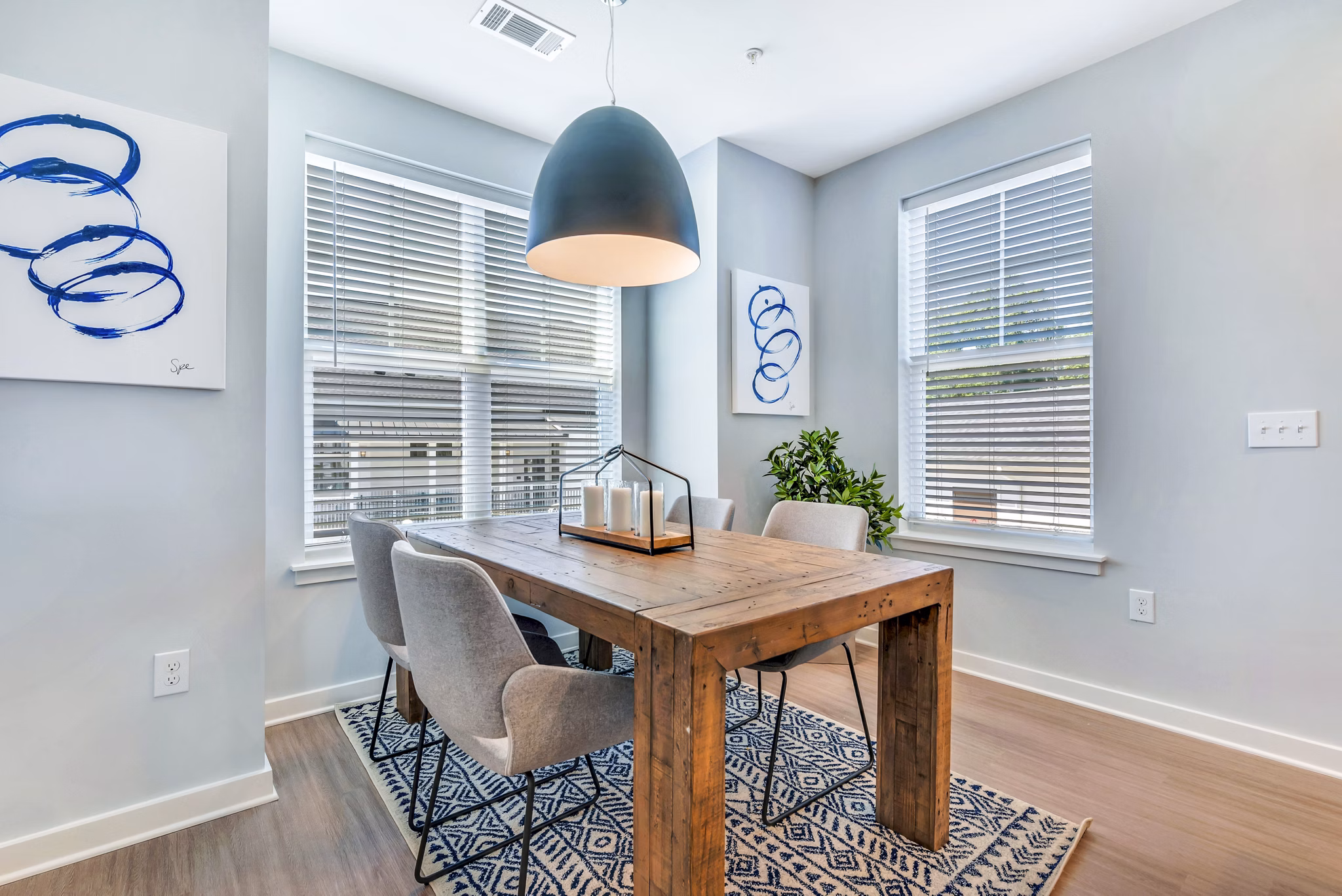 Dining room featuring elegant table setting and modern lighting at Alta Croft Apartments, luxury living spaces in a welcoming environment