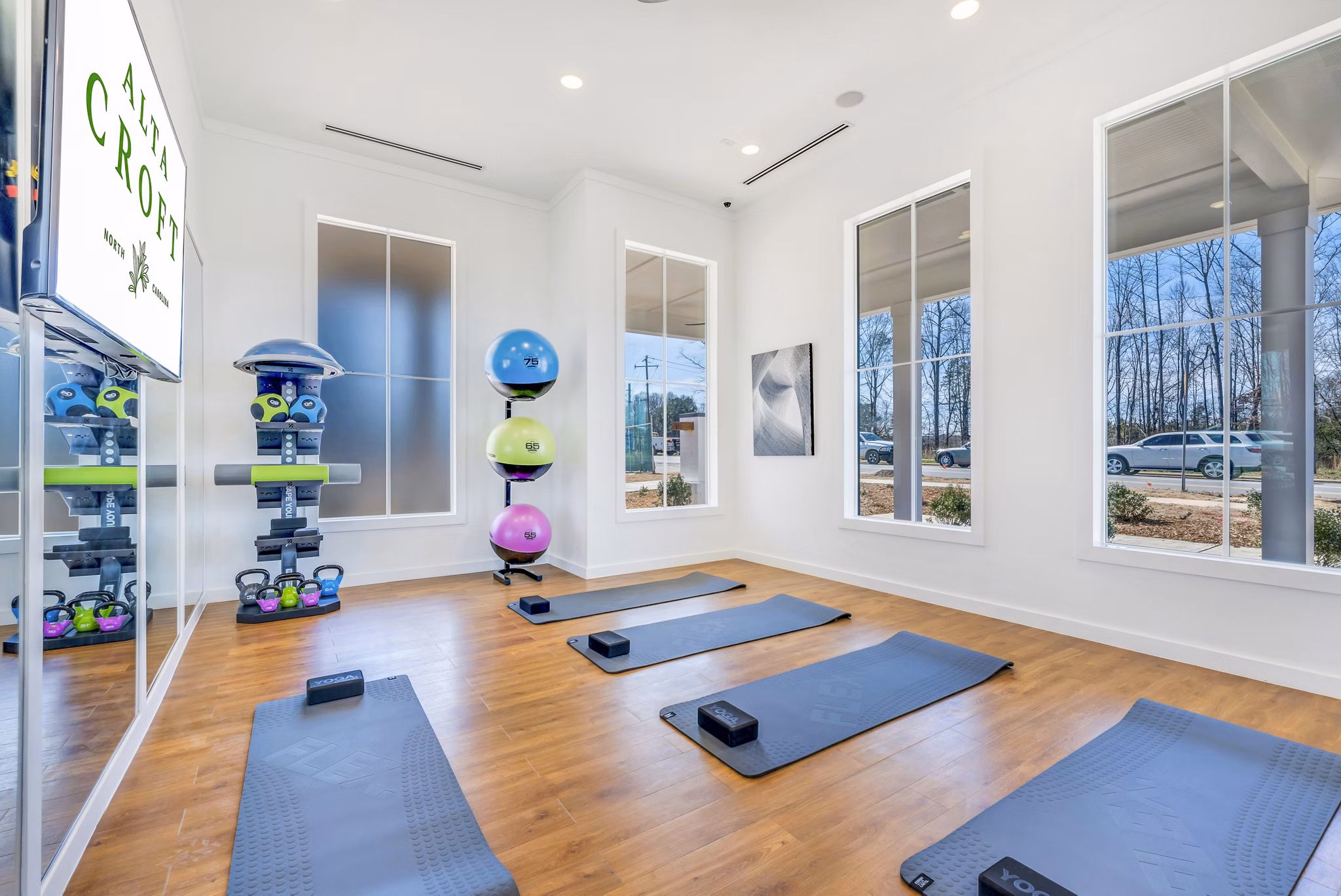Yoga and spin studio featuring modern equipment at Alta Croft Apartments, a luxury community by Greystar